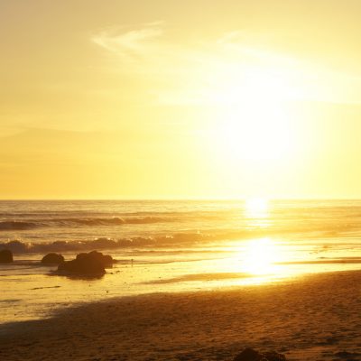 two men jogs on the beach